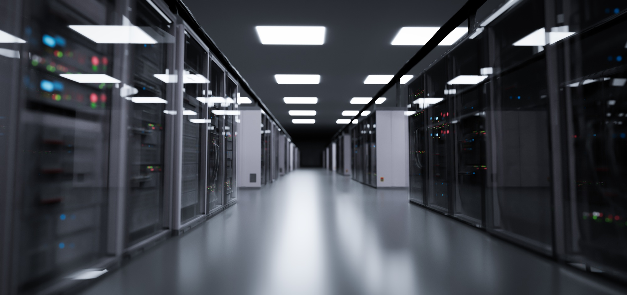 Data centre server corridor with illuminated racks, representing critical infrastructure power solutions